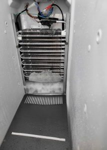 Freezer with ice build up on coils