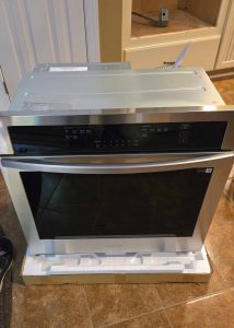 A newly unboxed Samsung wall oven, ready to be installed