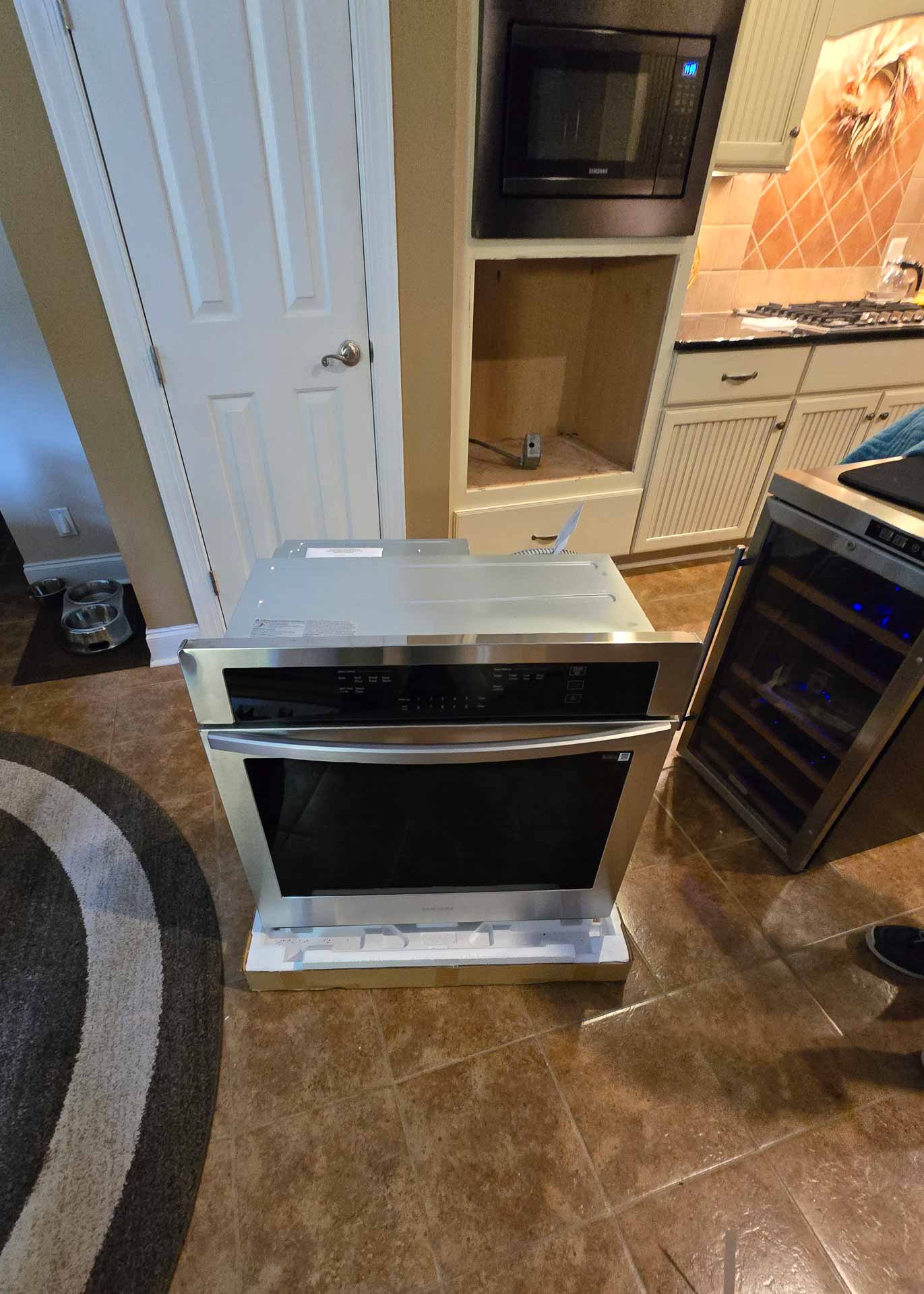 A newly unboxed Samsung wall oven, ready to be installed